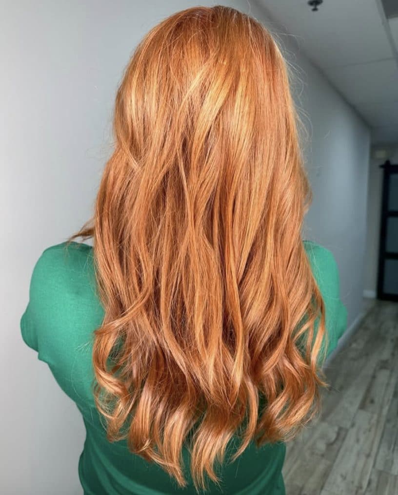 Long wavy copper red hair, back view