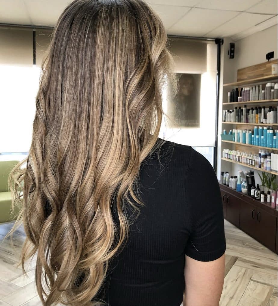 Long wavy bronde balayage with soft blonde ribbons