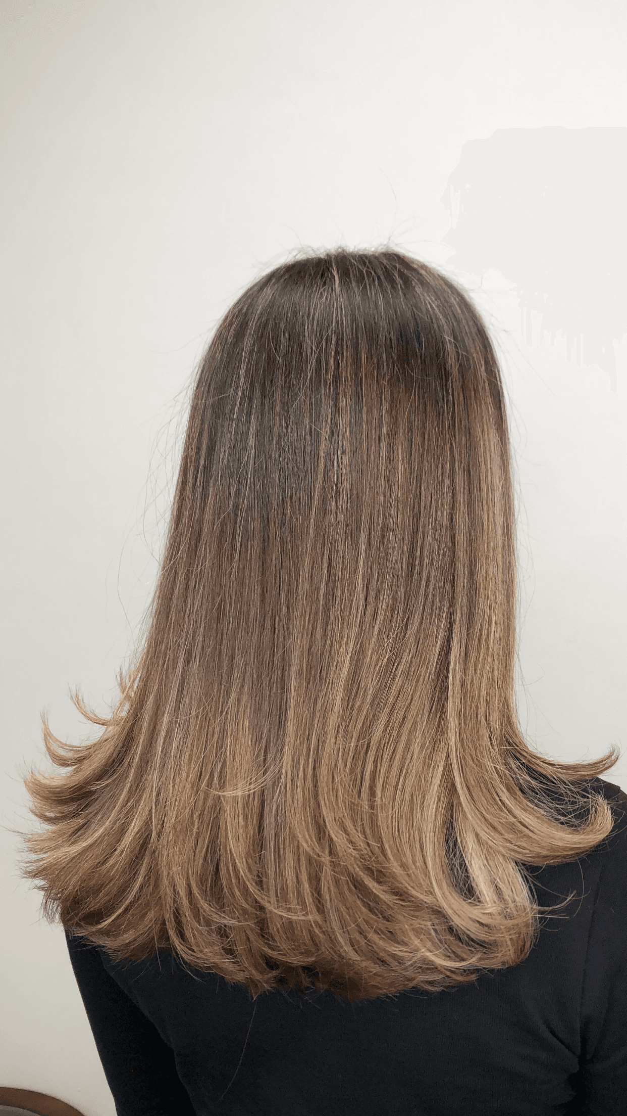 A modern, stylish haircut with clean lines and expertly crafted layers, showcasing a fresh and contemporary look.