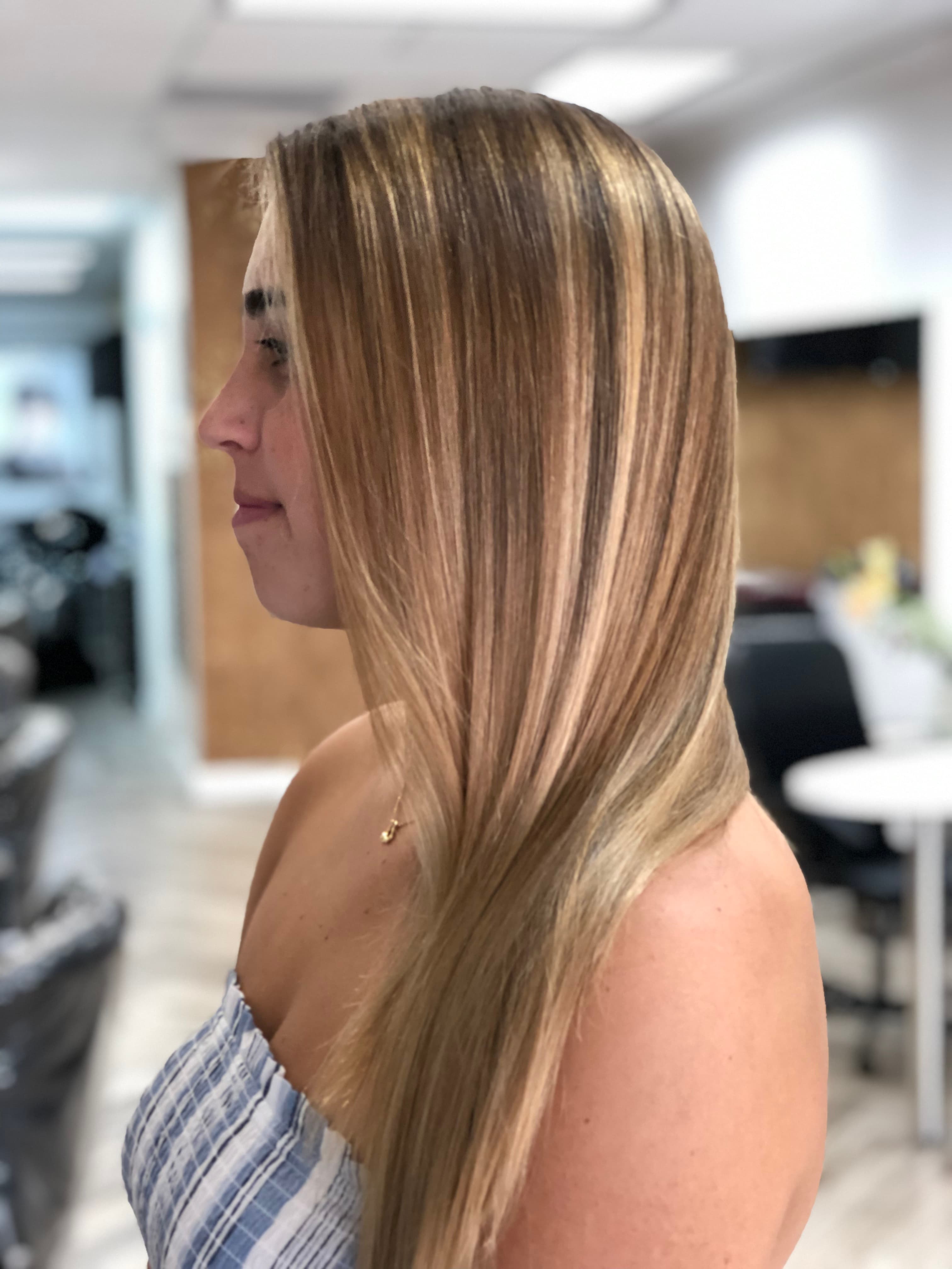 A modern, stylish haircut with clean lines and expertly crafted layers, showcasing a fresh and contemporary look.